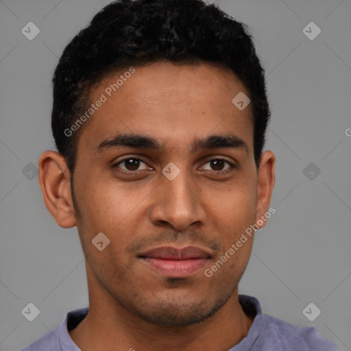 Joyful latino young-adult male with short  brown hair and brown eyes