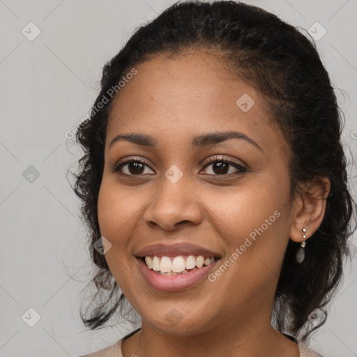 Joyful latino young-adult female with long  brown hair and brown eyes