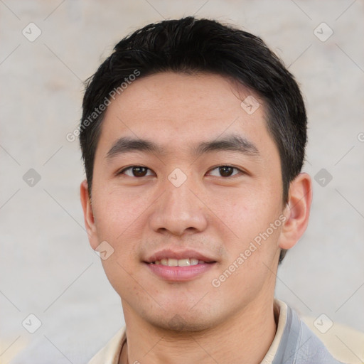 Joyful asian young-adult male with short  black hair and brown eyes