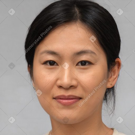 Joyful asian young-adult female with medium  brown hair and brown eyes