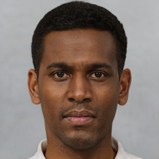 Neutral black young-adult male with short  black hair and brown eyes