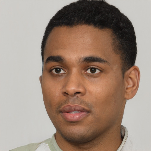 Neutral black young-adult male with short  black hair and brown eyes