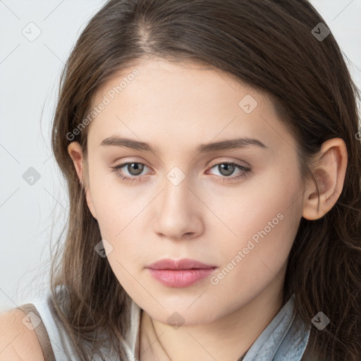 Neutral white young-adult female with long  brown hair and brown eyes