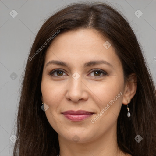 Joyful white young-adult female with long  brown hair and brown eyes