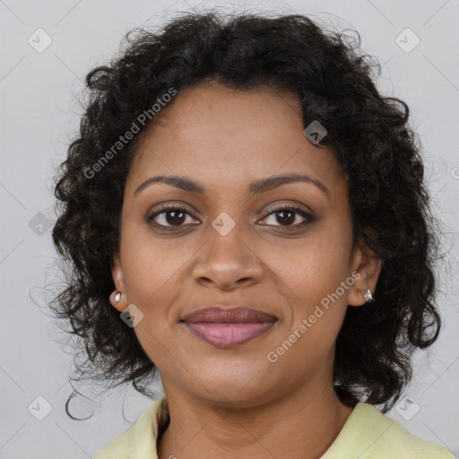 Joyful black young-adult female with long  brown hair and brown eyes