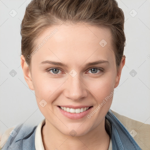 Joyful white young-adult female with short  brown hair and grey eyes