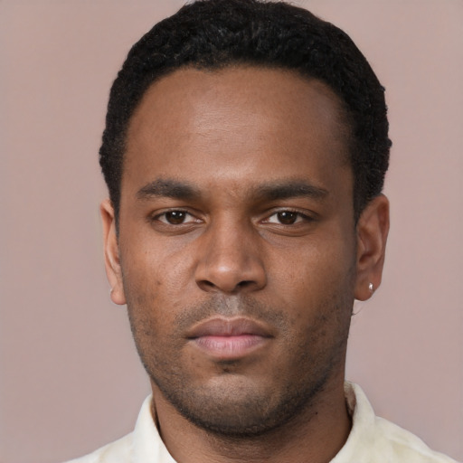 Neutral black young-adult male with short  black hair and brown eyes