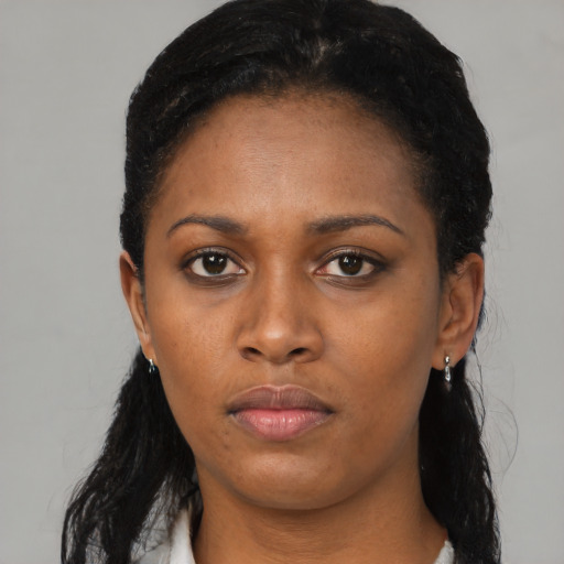 Neutral black young-adult female with long  black hair and brown eyes