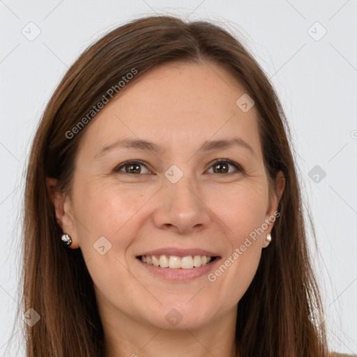 Joyful white adult female with long  brown hair and brown eyes