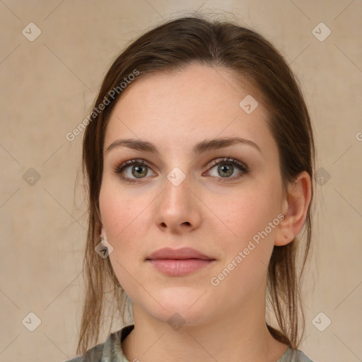 Joyful white young-adult female with medium  brown hair and grey eyes