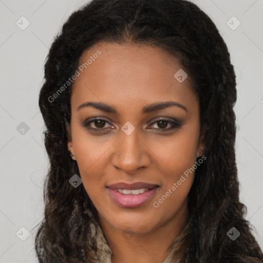 Joyful black young-adult female with long  brown hair and brown eyes