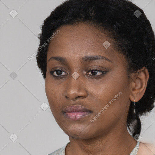 Neutral black young-adult female with short  black hair and brown eyes