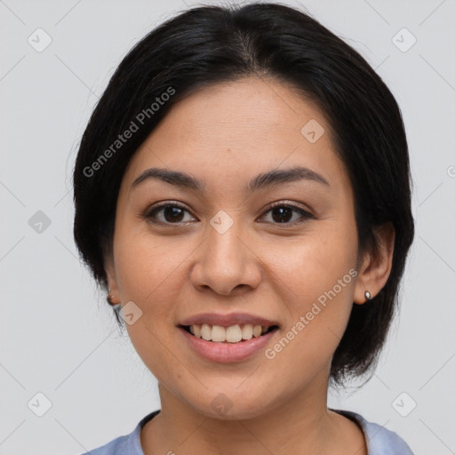 Joyful latino young-adult female with medium  brown hair and brown eyes