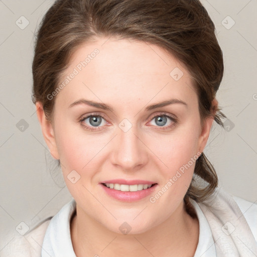 Joyful white young-adult female with medium  brown hair and blue eyes