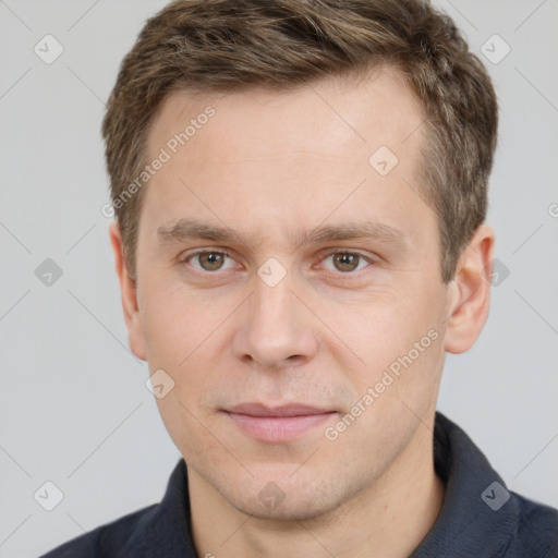 Joyful white young-adult male with short  brown hair and grey eyes