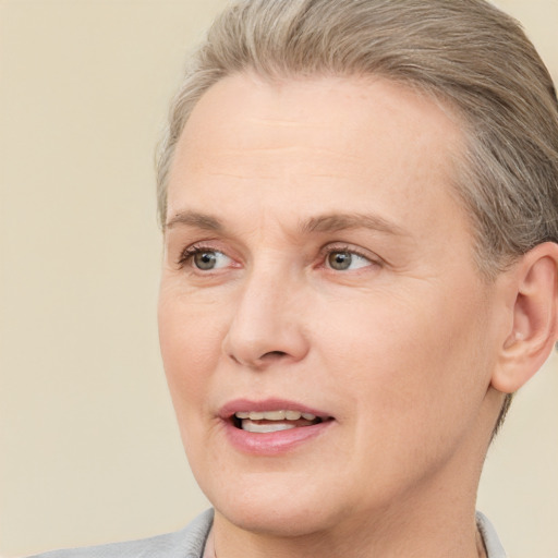 Joyful white adult female with short  brown hair and brown eyes