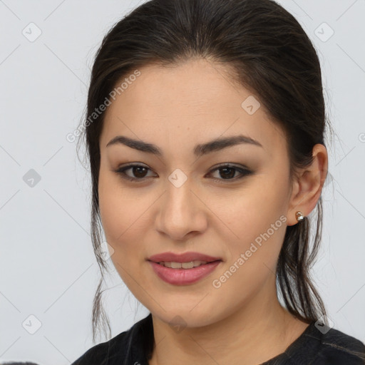 Joyful asian young-adult female with long  brown hair and brown eyes