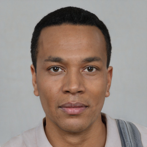 Neutral black young-adult male with short  black hair and brown eyes