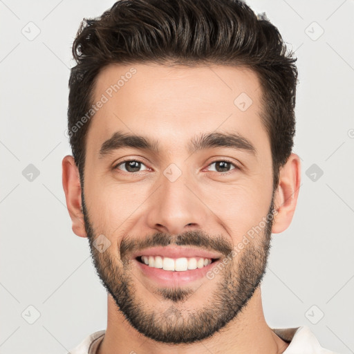 Joyful white young-adult male with short  black hair and brown eyes