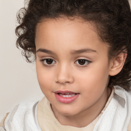 Joyful white child female with medium  brown hair and brown eyes