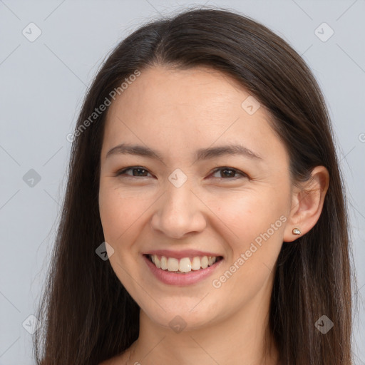 Joyful white young-adult female with long  brown hair and brown eyes