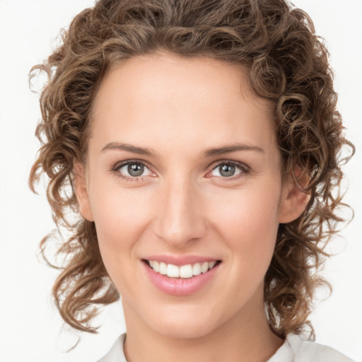 Joyful white young-adult female with medium  brown hair and green eyes