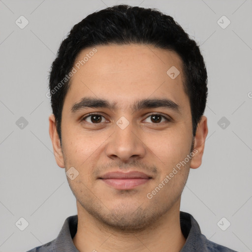 Joyful latino young-adult male with short  black hair and brown eyes