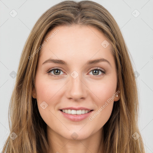 Joyful white young-adult female with long  brown hair and green eyes