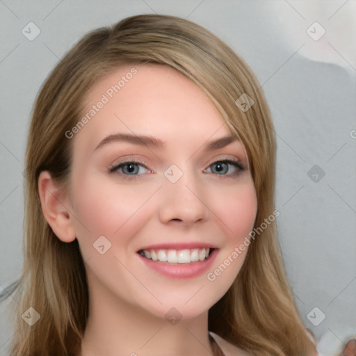 Joyful white young-adult female with long  brown hair and blue eyes