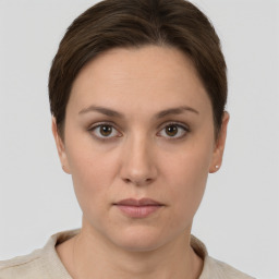 Neutral white young-adult female with short  brown hair and grey eyes