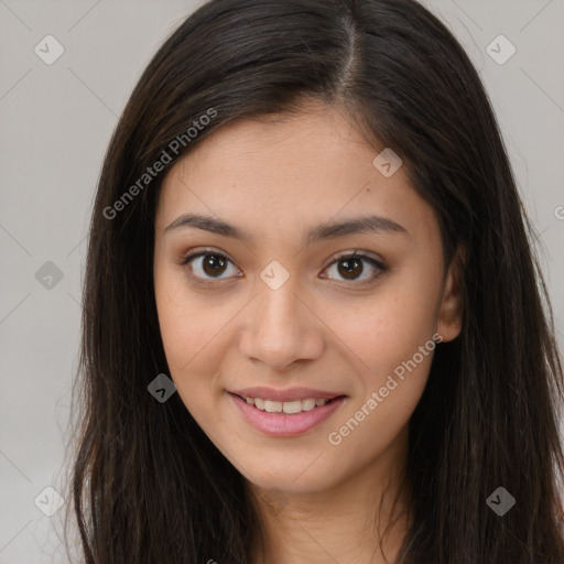 Joyful asian young-adult female with long  brown hair and brown eyes