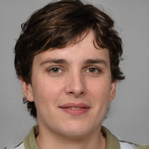 Joyful white young-adult male with medium  brown hair and brown eyes