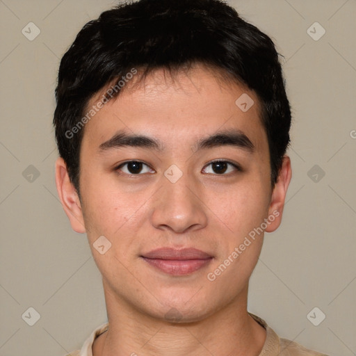 Joyful asian young-adult male with short  brown hair and brown eyes