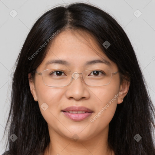 Joyful white adult female with long  brown hair and brown eyes