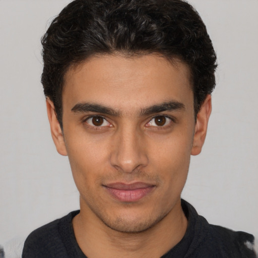 Neutral white young-adult male with short  black hair and brown eyes
