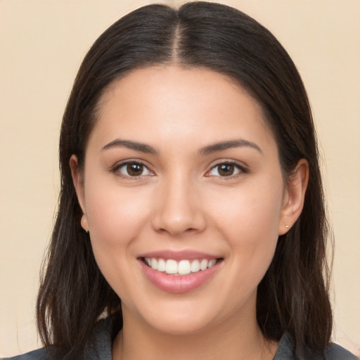 Joyful white young-adult female with long  brown hair and brown eyes