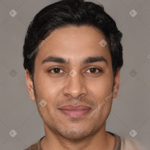 Joyful latino young-adult male with short  black hair and brown eyes