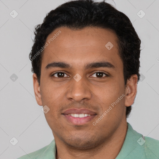 Joyful latino young-adult male with short  brown hair and brown eyes