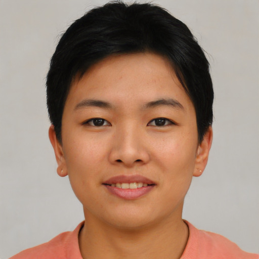 Joyful asian young-adult female with short  black hair and brown eyes