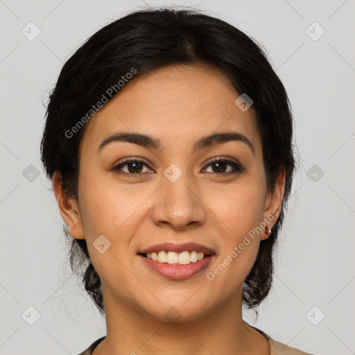 Joyful latino young-adult female with medium  brown hair and brown eyes