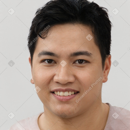 Joyful asian young-adult male with short  black hair and brown eyes