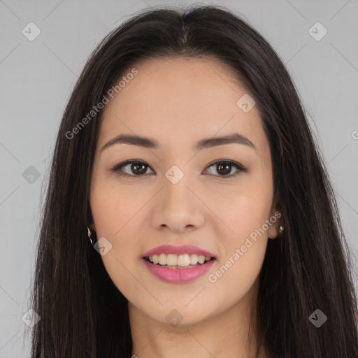 Joyful asian young-adult female with long  brown hair and brown eyes