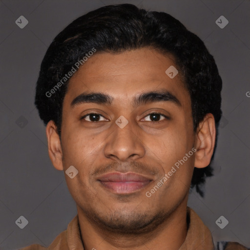 Joyful latino young-adult male with short  brown hair and brown eyes