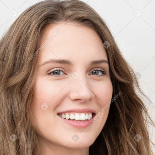 Joyful white young-adult female with long  brown hair and green eyes