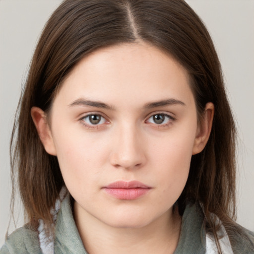 Neutral white young-adult female with long  brown hair and brown eyes