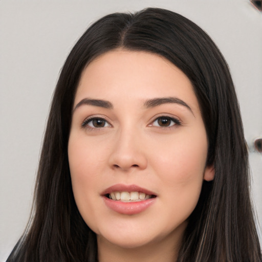 Joyful white young-adult female with long  black hair and brown eyes