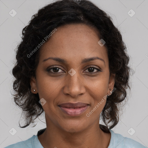 Joyful black young-adult female with medium  brown hair and brown eyes