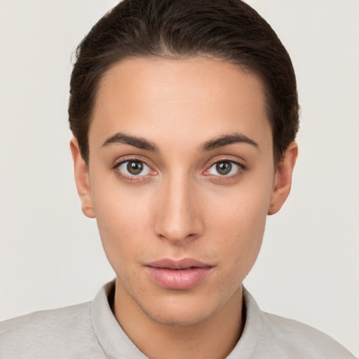 Neutral white young-adult female with short  brown hair and brown eyes