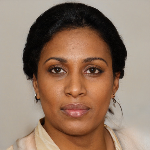 Neutral black young-adult female with medium  black hair and brown eyes