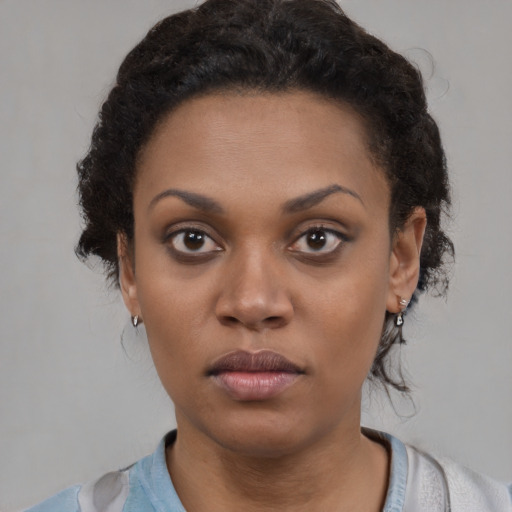 Neutral black young-adult female with medium  black hair and brown eyes